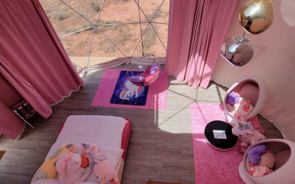 Pink-Unicorn-Family-Dome-Grand-Canyon Interior of pink unicorn themed lodging sky dome at Clear Sky Resorts in Valle, AZ