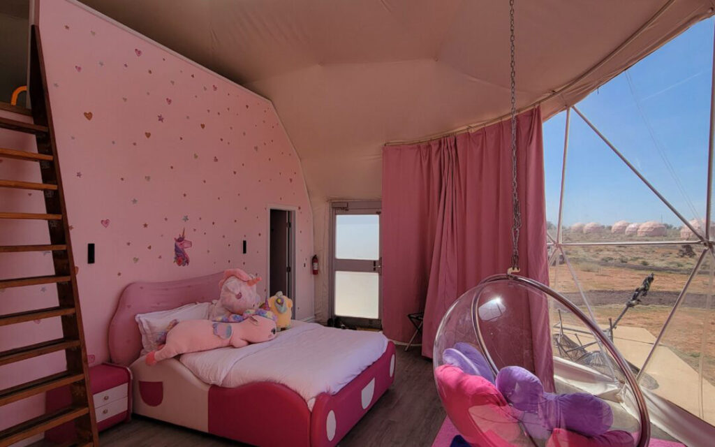 Pink-Unicorn-Family-Dome-Grand-Canyon2 Interior of pink unicorn themed lodging sky dome at Clear Sky Resorts in Valle, AZ