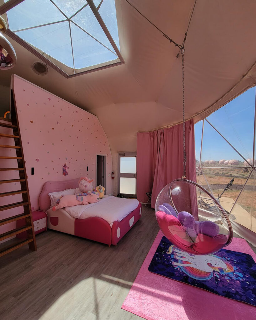 Pink-Unicorn-Family-Dome-Grand-Canyon3 Interior of pink unicorn themed lodging sky dome at Clear Sky Resorts in Valle, AZ